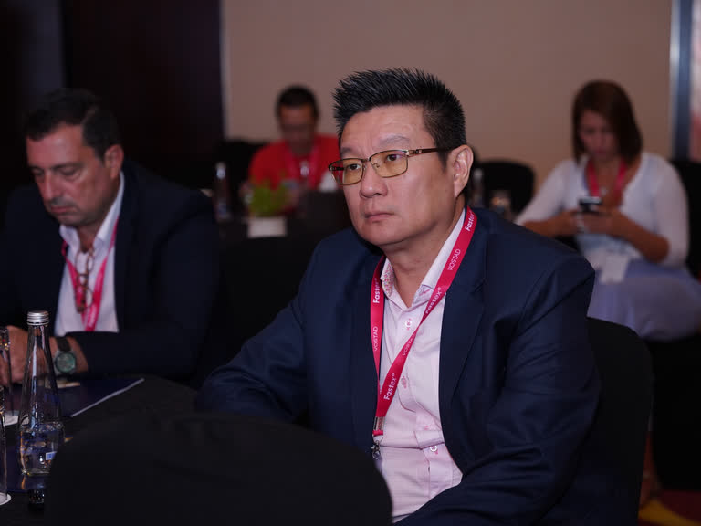 Delegates seated in a conference audience
