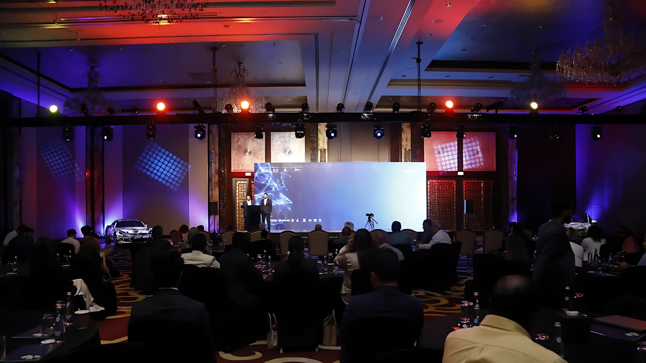 A summit ballroom during a plenary session
