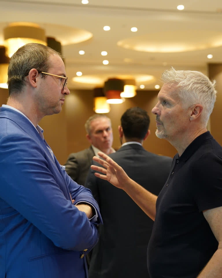Delegates talking together at a conference